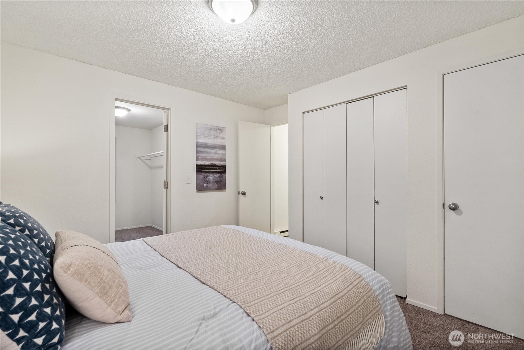4785 Northwest Anderson Hill Road Silverdale, WA 98383 - Photo 26 of 38 a bedroom with a bed and a closet