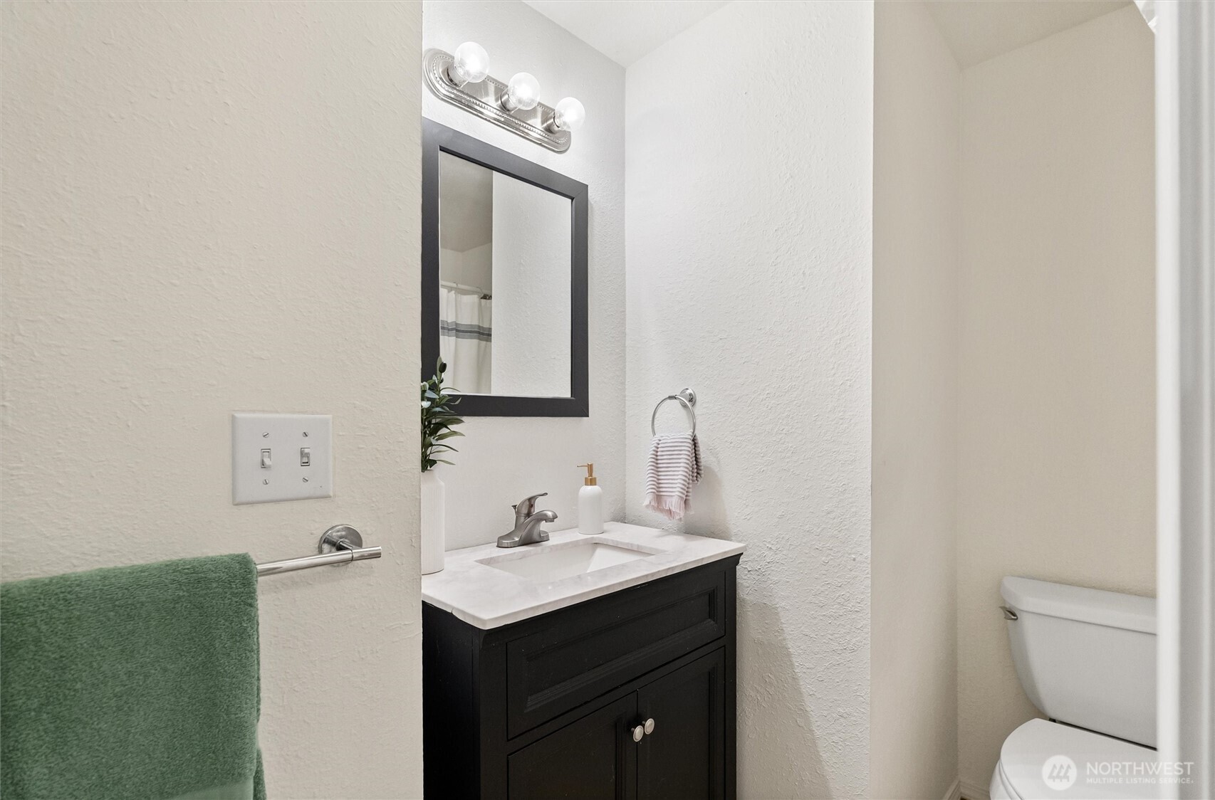 4785 Northwest Anderson Hill Road Silverdale, WA 98383 - Photo 28 of 38 a bathroom with a toilet sink and mirror