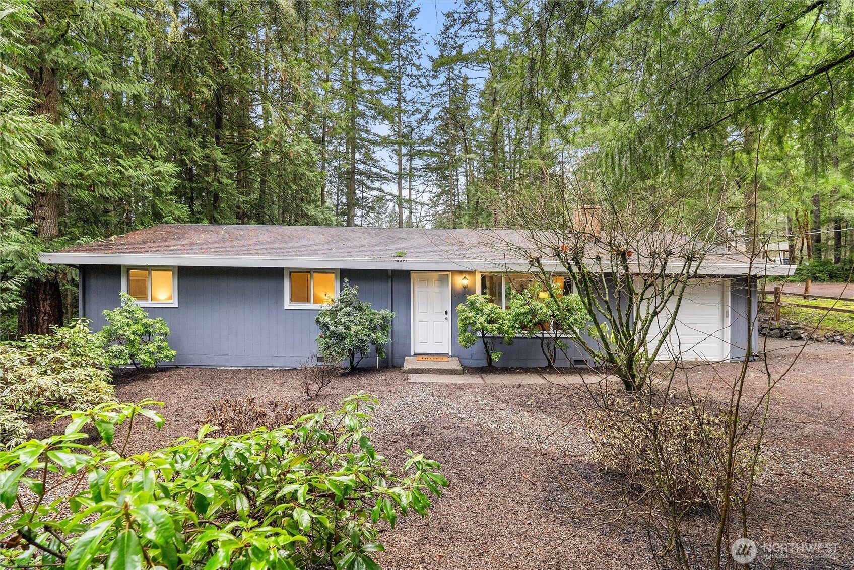 4785 Northwest Anderson Hill Road Silverdale, WA 98383 - Photo 3 of 38 front view of a house with a yard