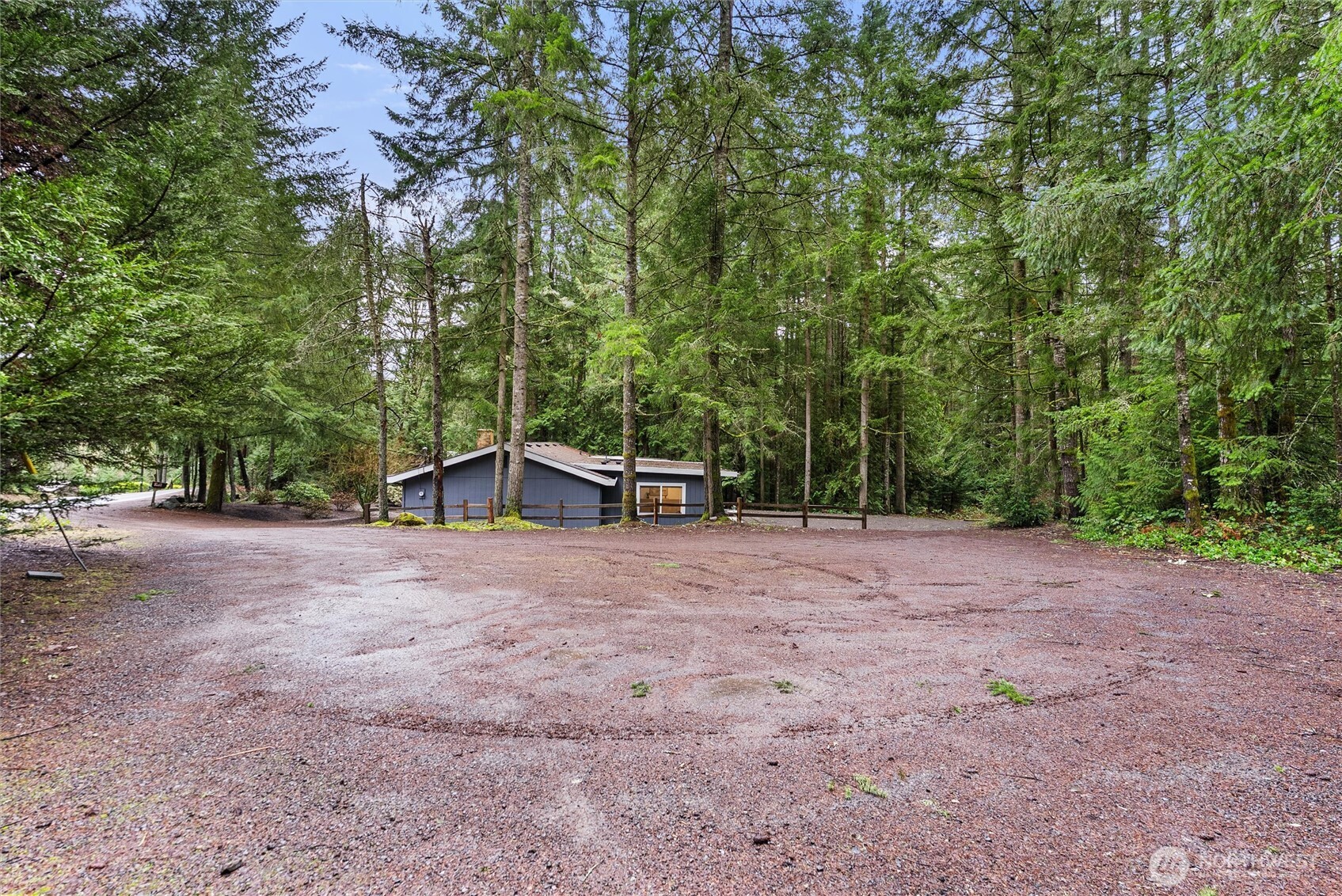 4785 Northwest Anderson Hill Road Silverdale, WA 98383 - Photo 34 of 38 a view of a house with backyard and trees