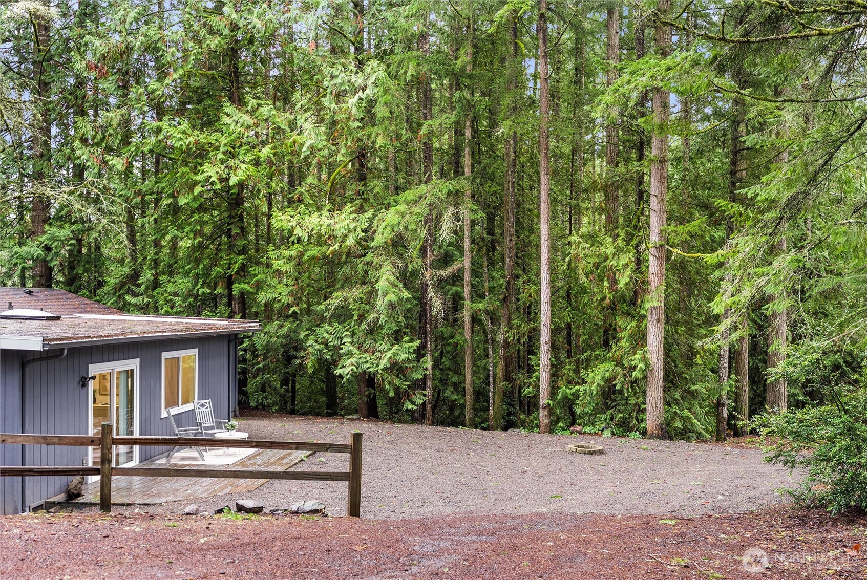 4785 Northwest Anderson Hill Road Silverdale, WA 98383 - Photo 35 of 38 a view of a house with a tree
