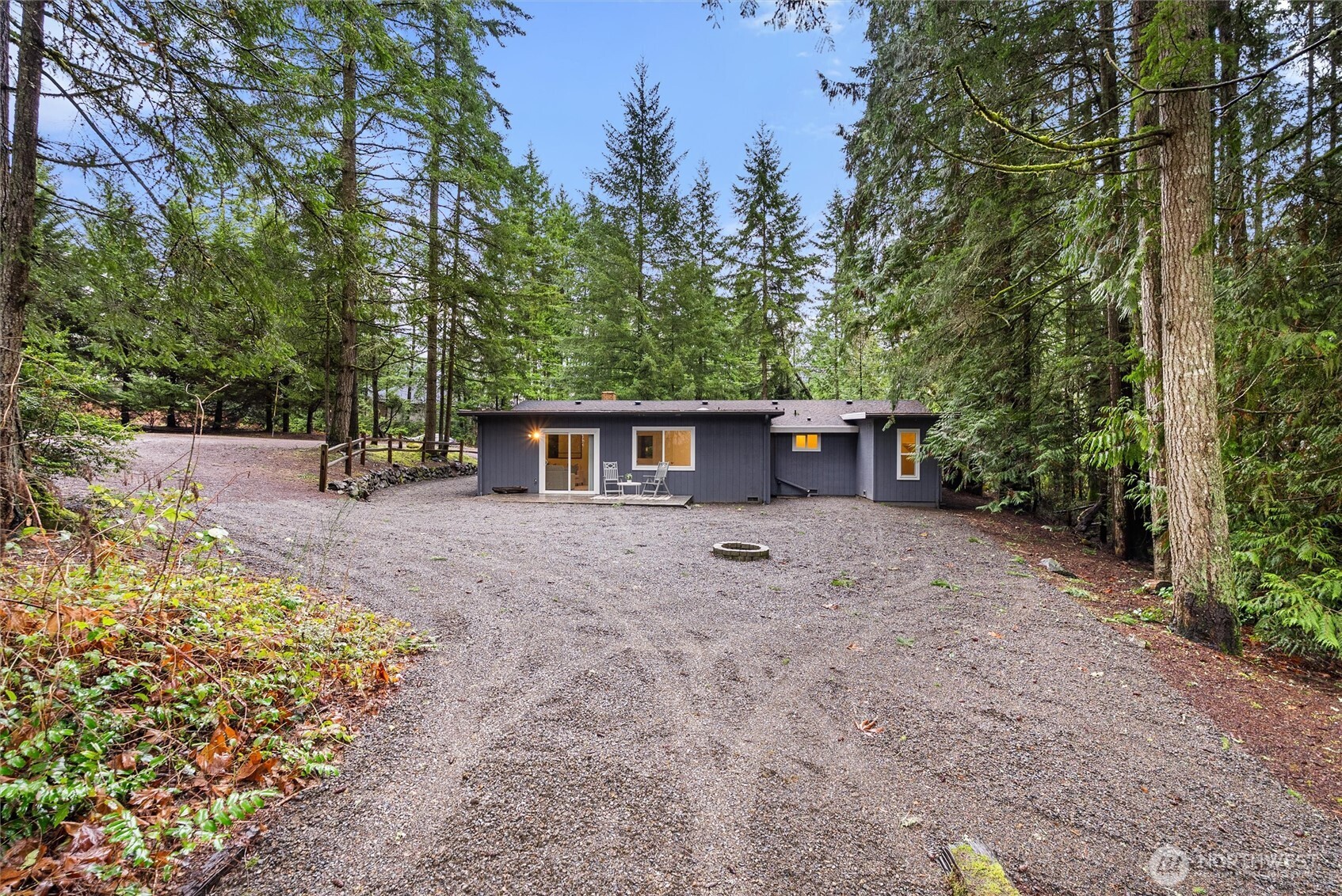 4785 Northwest Anderson Hill Road Silverdale, WA 98383 - Photo 36 of 38 a view of a house with a yard and tree s