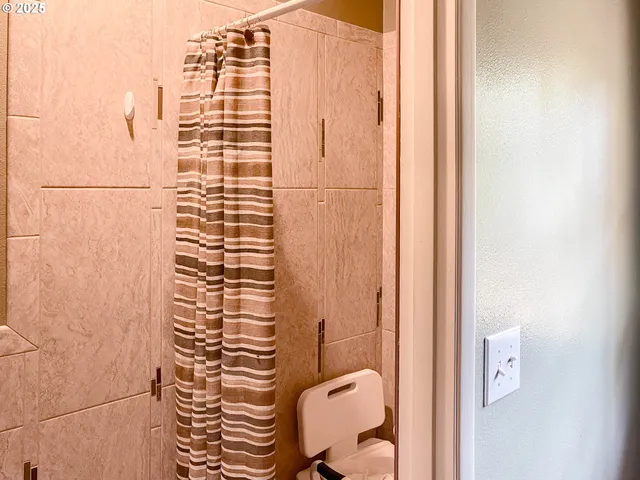 a bedroom with bed and window