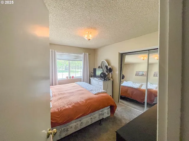 a living room with lots of furniture and a chandelier