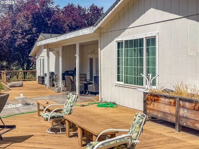 a view of swimming pool and trees in the background