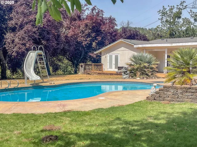 a front view of house with yard and outdoor seating