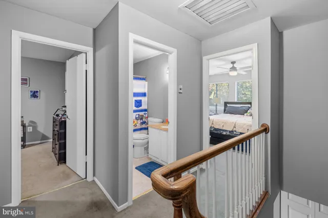 a view of a hallway with a bedroom