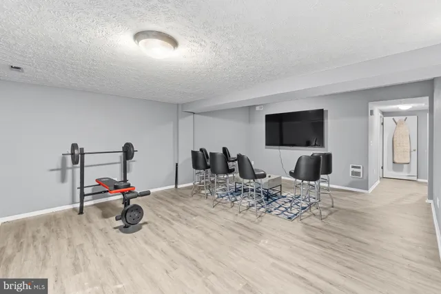 a view of a livingroom with furniture and a flat screen tv