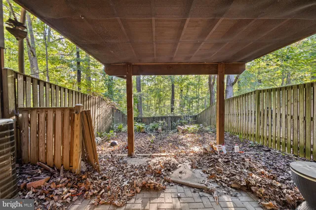 a view of a house with a small yard and plants