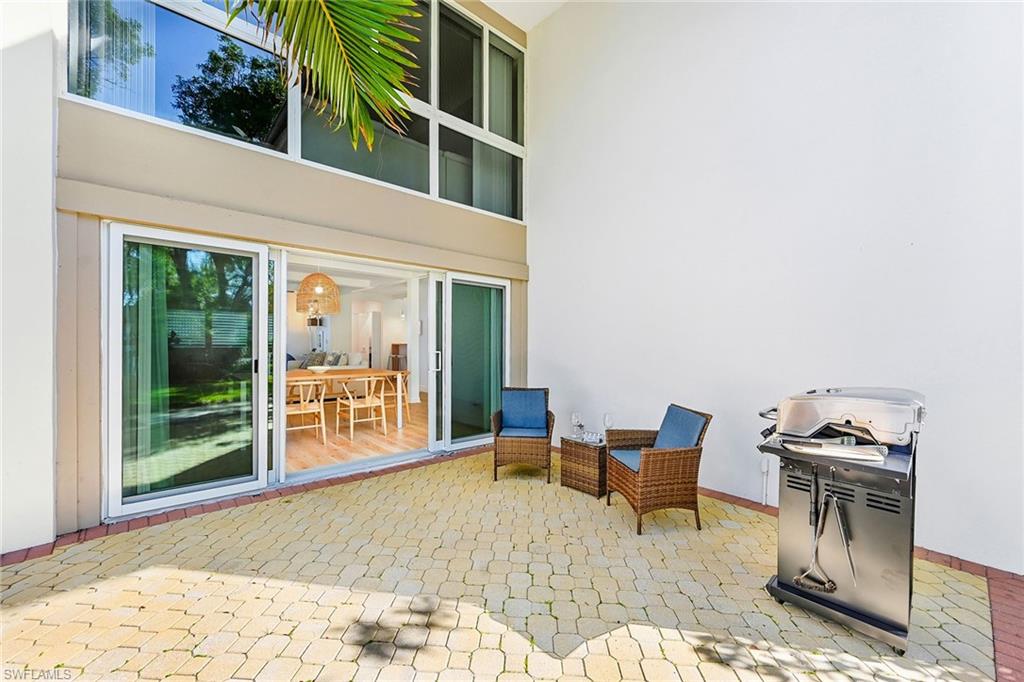 1334 Crayton Road, Unit 1 Naples, FL 34102 - Photo 21 of 22 Patio Area with Gas Grill