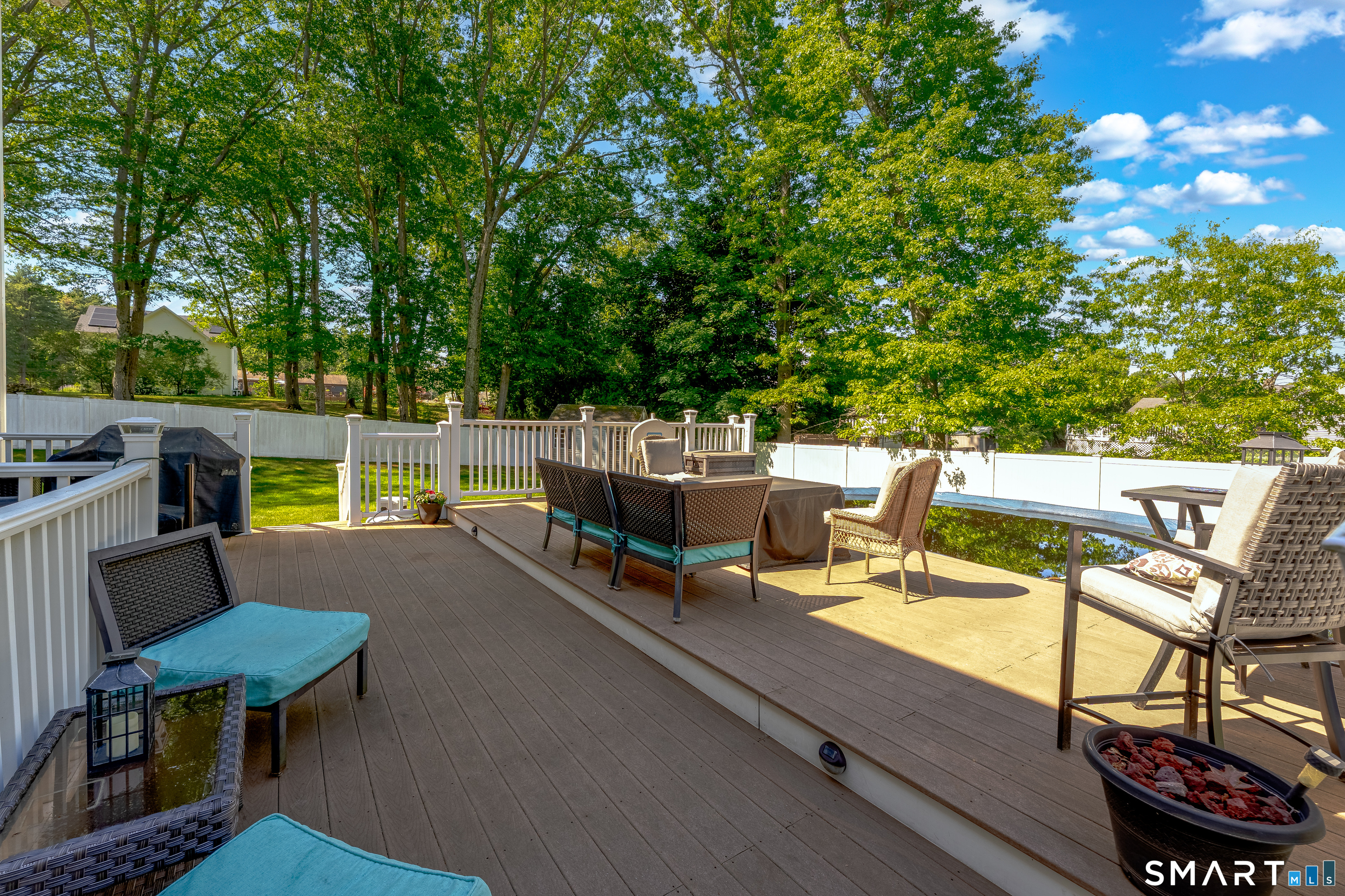 261 Spring Road North Haven, CT 06473 - Photo 8 of 39 a view of a chairs and table in patio
