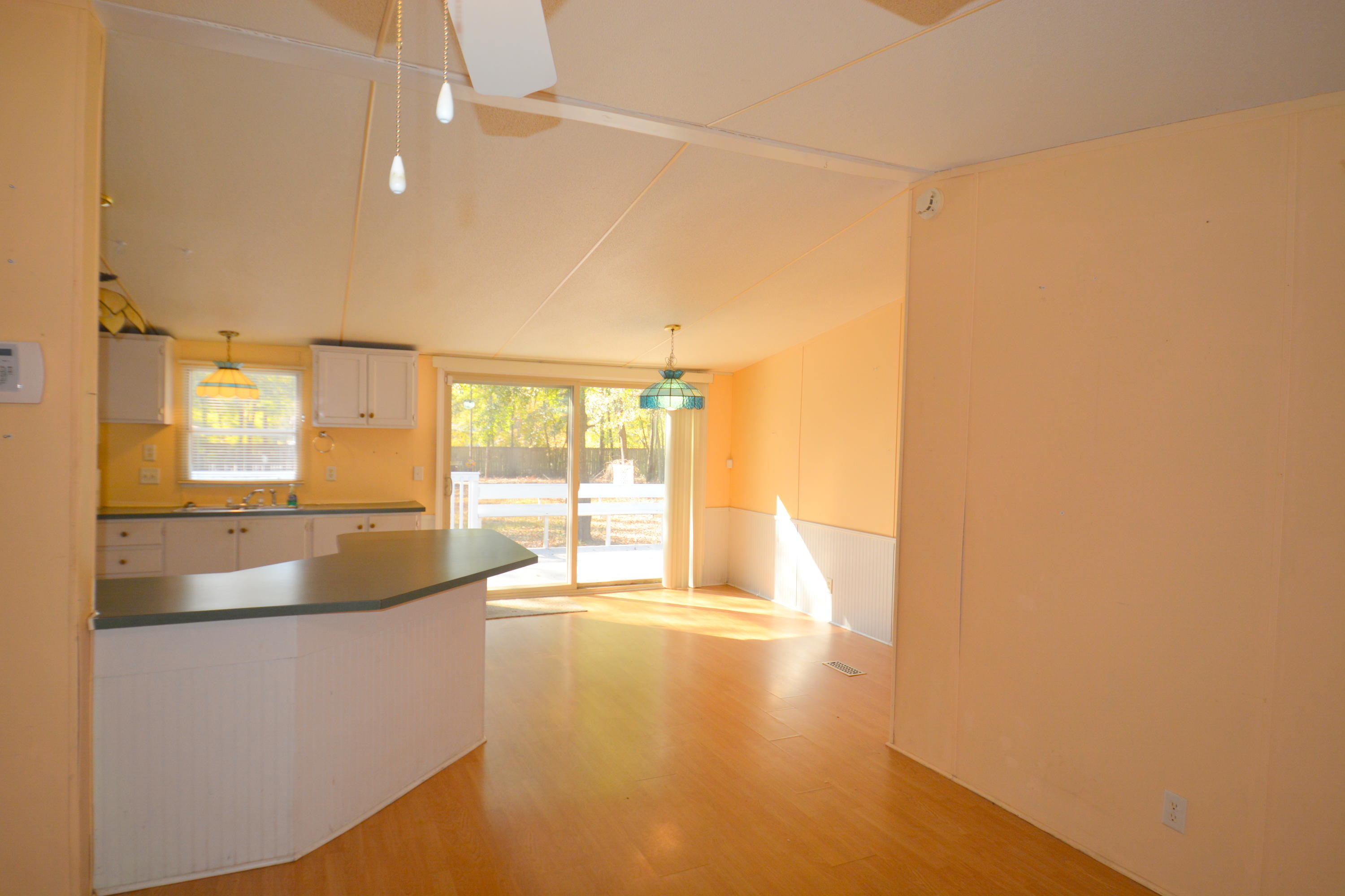 5729 Blufton Road Hollywood, SC 29449 - Photo 19 of 32 Dining area and sliding glass doors lead