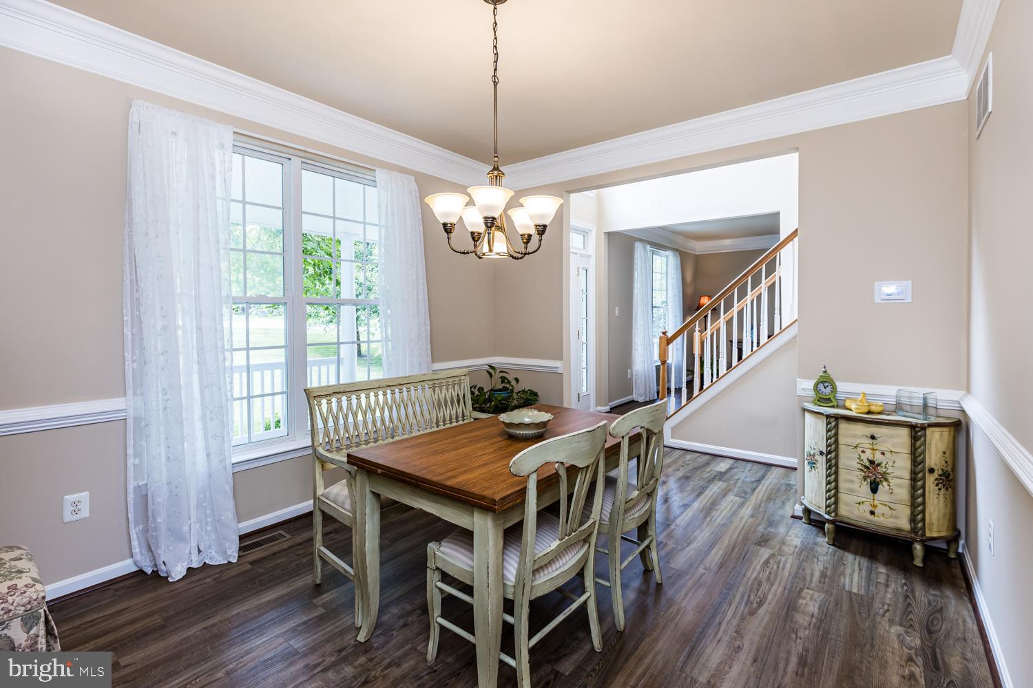 3931 Hunter Road Ellicott City, MD 21043 - Photo 16 of 50 Formal Dining room with window to front and open