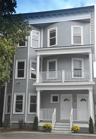 9 Washburn Terrace, Unit 2 Brookline, MA 02446 - Photo 1 of 9 a front view of residential houses