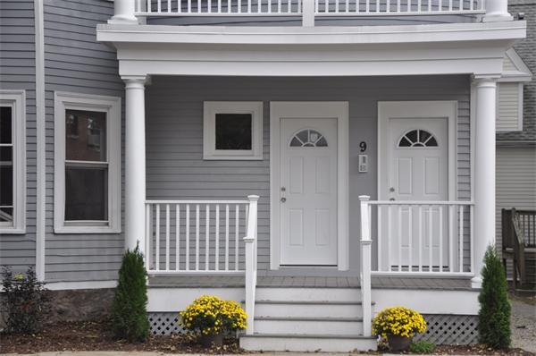 9 Washburn Terrace, Unit 2 Brookline, MA 02446 - Photo 2 of 9 a front view of a house with outdoor seating