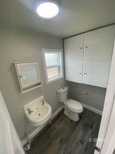 461 South Norma Street Ridgecrest, CA 93555 - Photo 13 of 17 a bathroom with a sink toilet and mirror