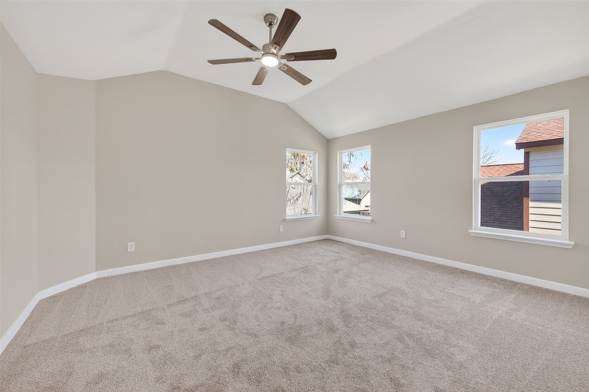2318 Irish Spring Drive Houston, TX 77067 - Photo 19 of 25 an empty room with a window and a fan