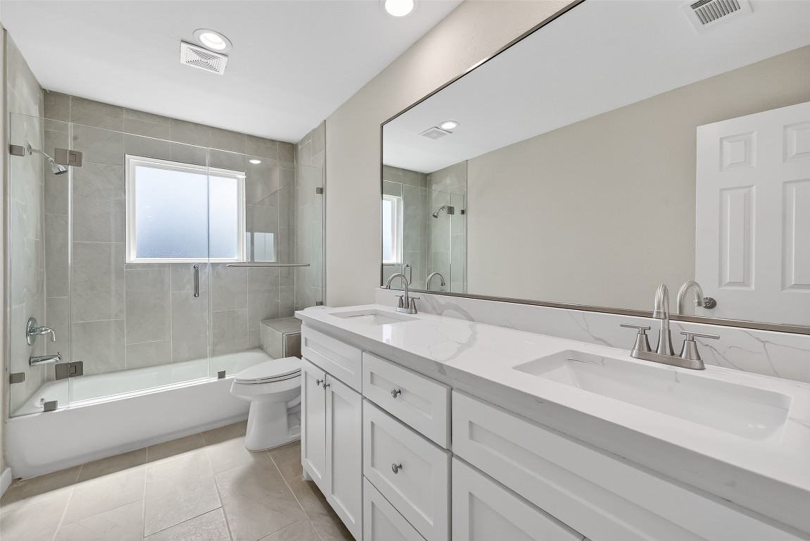 2318 Irish Spring Drive Houston, TX 77067 - Photo 20 of 25 a bathroom with a double vanity sink mirror double and bathtub