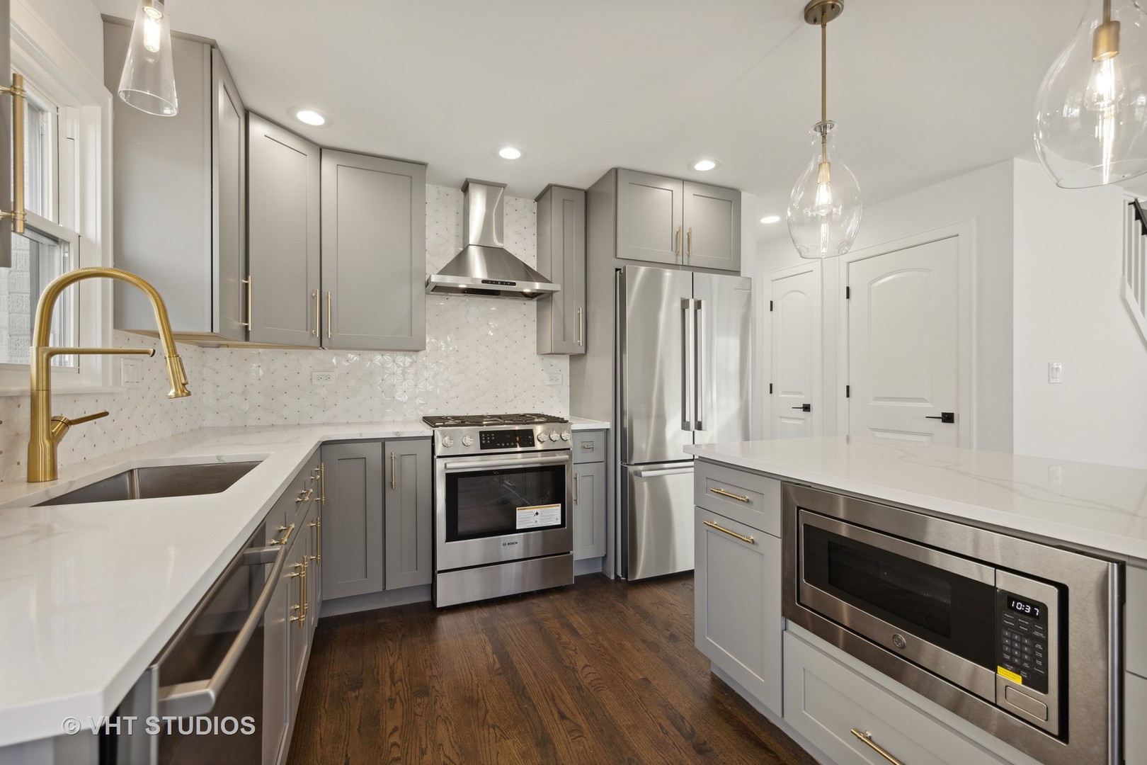771 Swain Avenue Elmhurst, IL 60126 - Photo 13 of 43 a kitchen with granite countertop a sink stainless steel appliances and cabinets