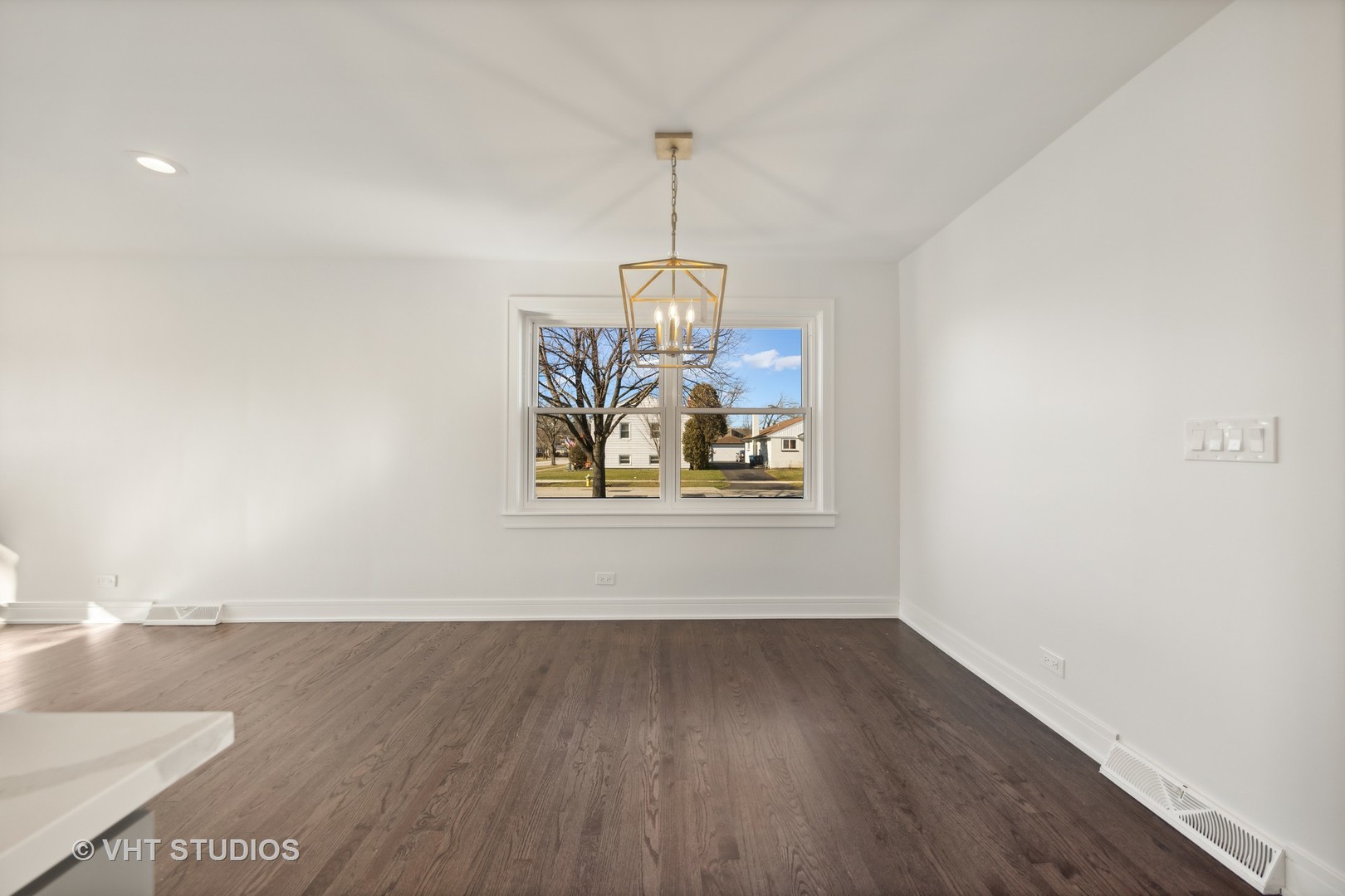 771 Swain Avenue Elmhurst, IL 60126 - Photo 15 of 43 a view of a hallway with wooden floor and a window