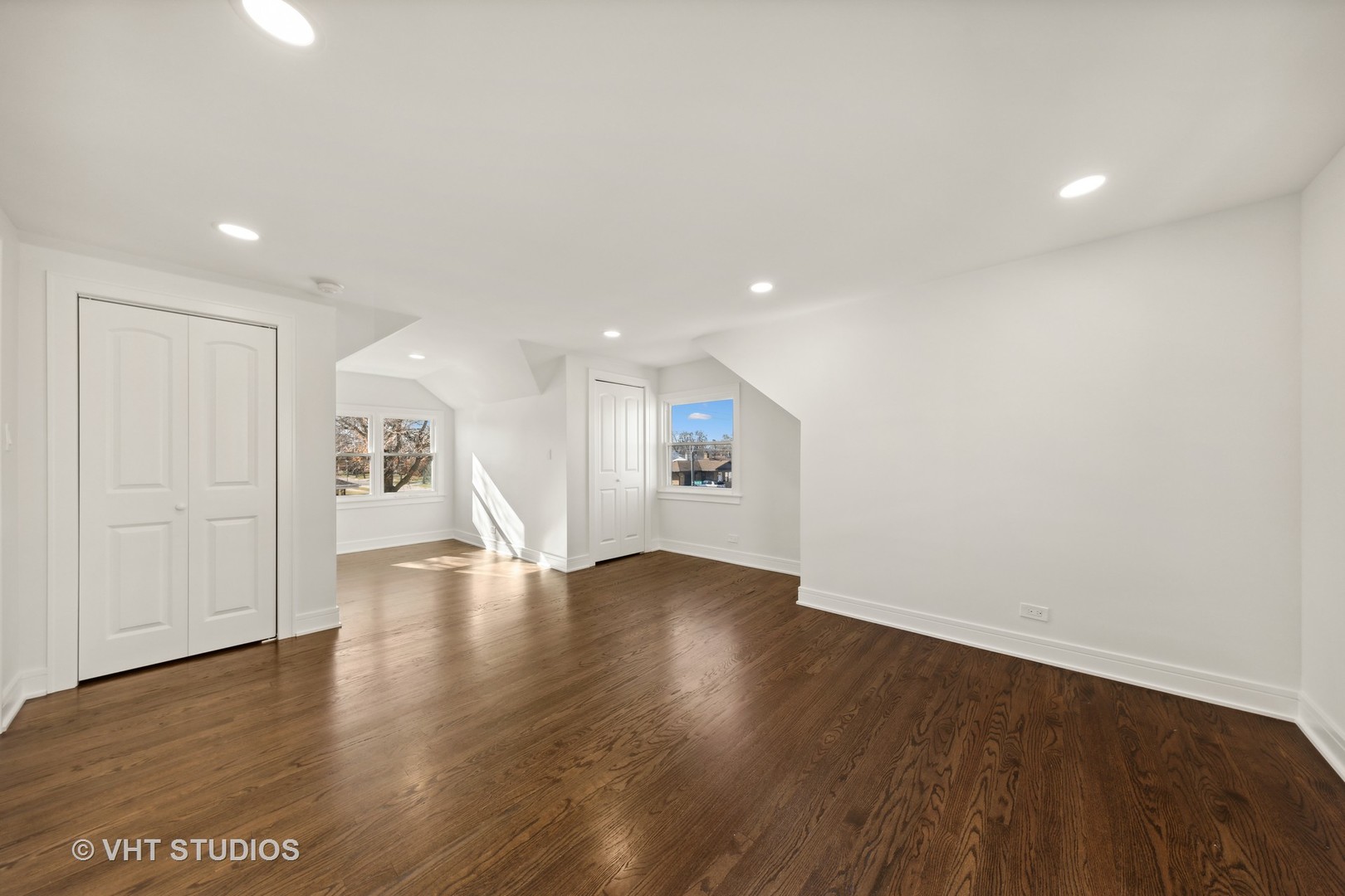 771 Swain Avenue Elmhurst, IL 60126 - Photo 17 of 43 an empty room with wooden floor and windows