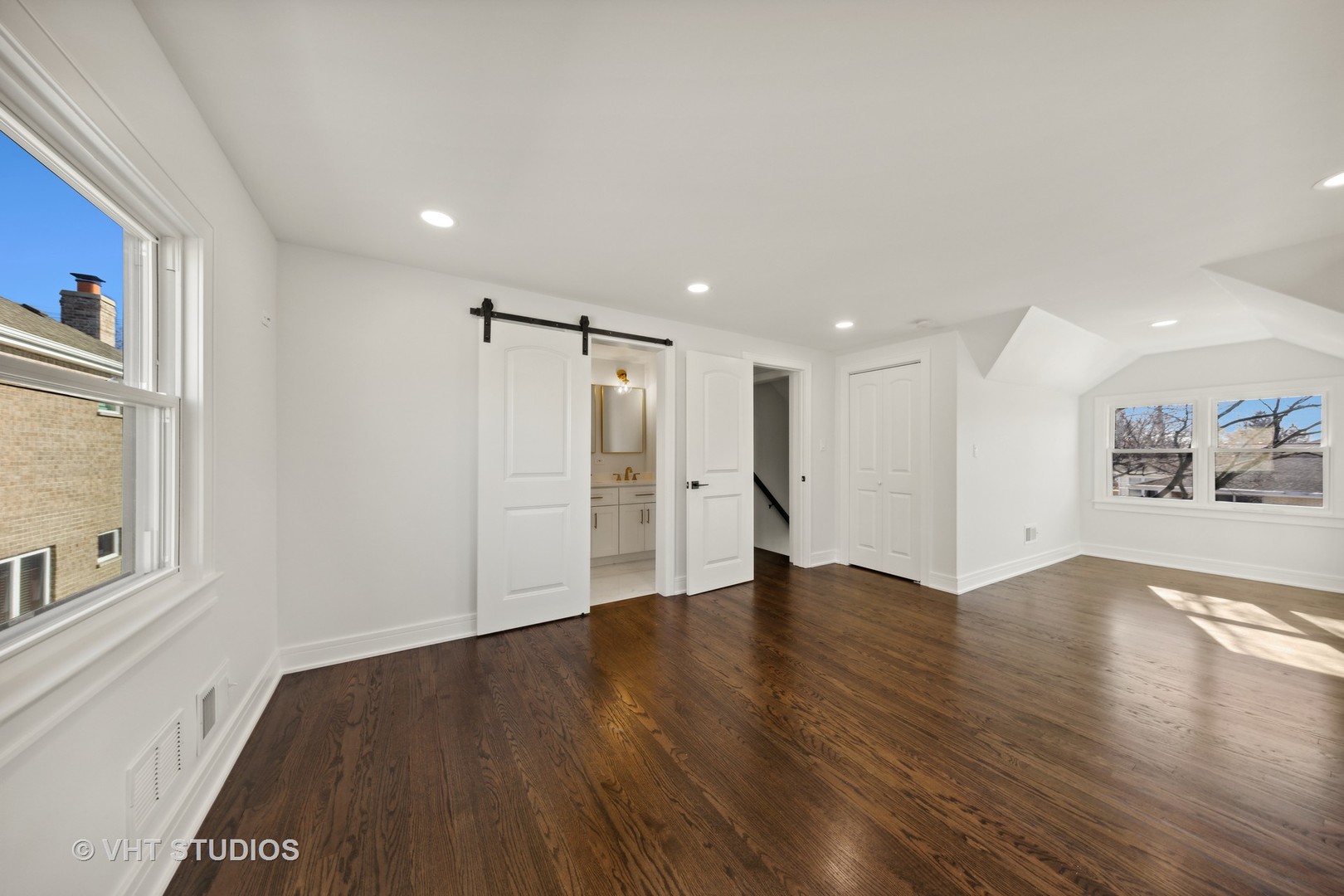 771 Swain Avenue Elmhurst, IL 60126 - Photo 19 of 43 a view of an empty room with wooden floor and a window