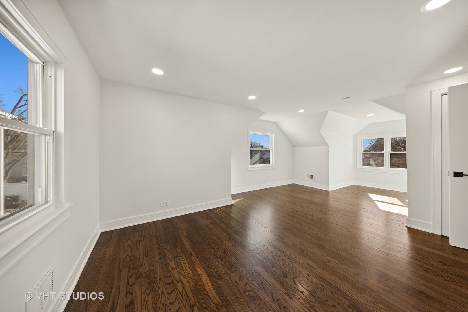 771 Swain Avenue Elmhurst, IL 60126 - Photo 23 of 43 an empty room with wooden floor and windows