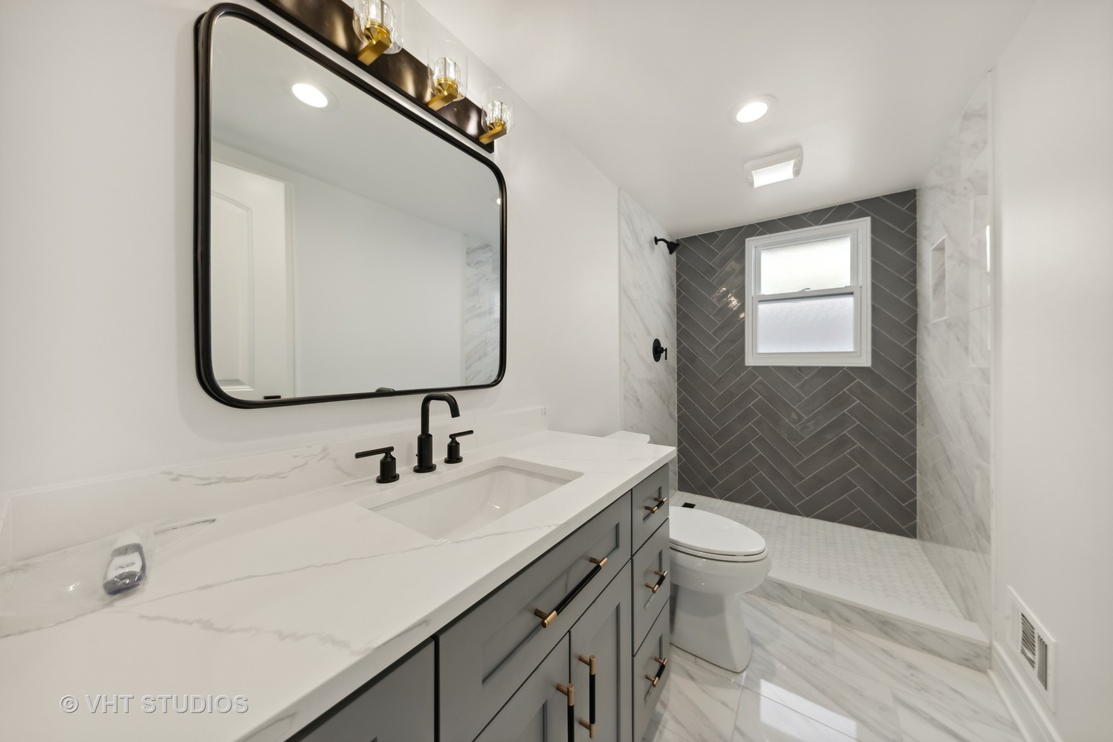 771 Swain Avenue Elmhurst, IL 60126 - Photo 25 of 43 a bathroom with a sink a toilet and mirror