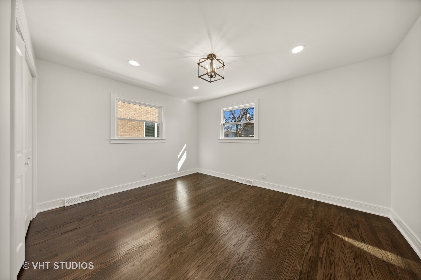 771 Swain Avenue Elmhurst, IL 60126 - Photo 27 of 43 wooden floor in an empty room with a window