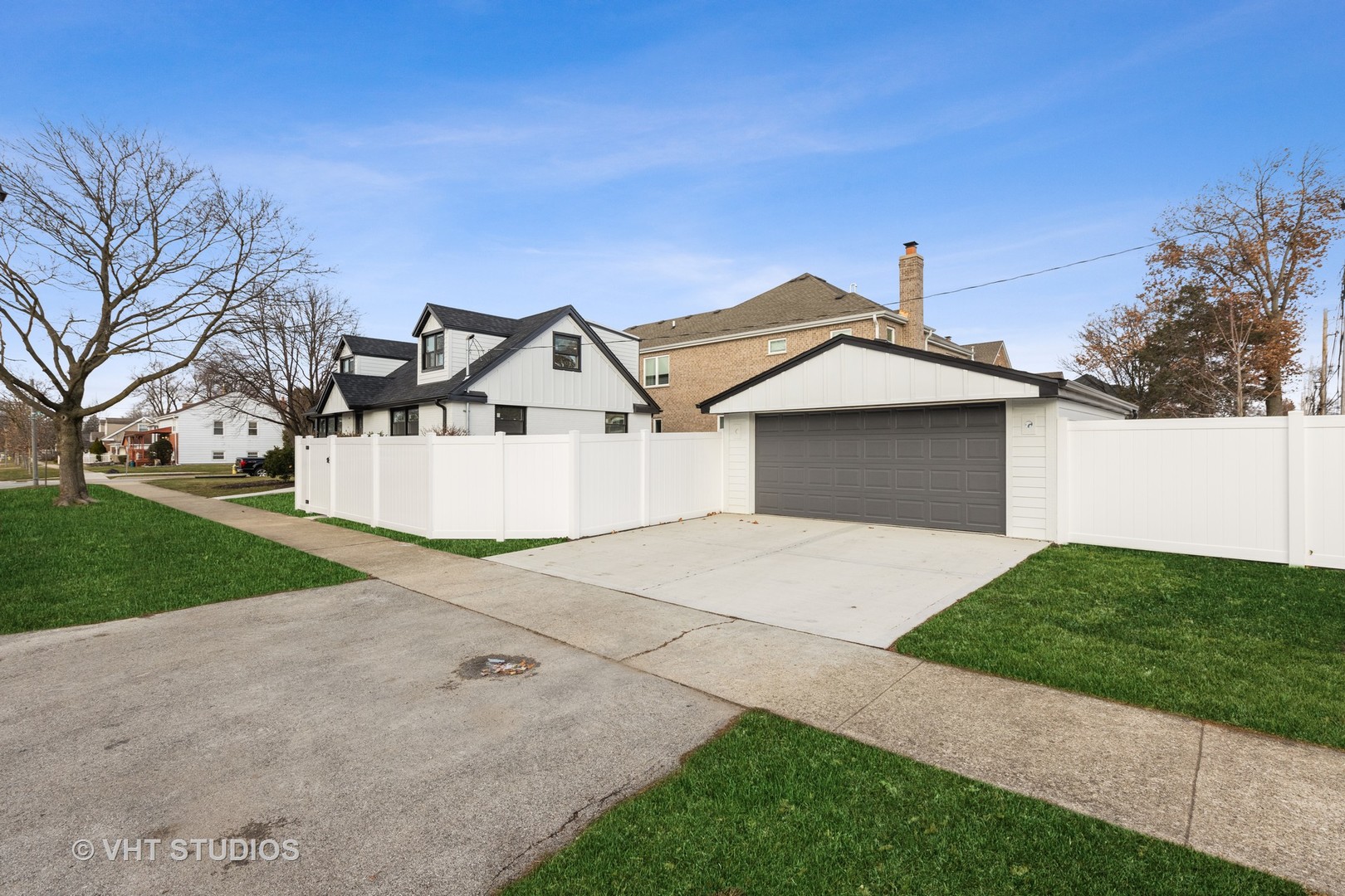 771 Swain Avenue Elmhurst, IL 60126 - Photo 39 of 43 a front view of a house with a yard and garage