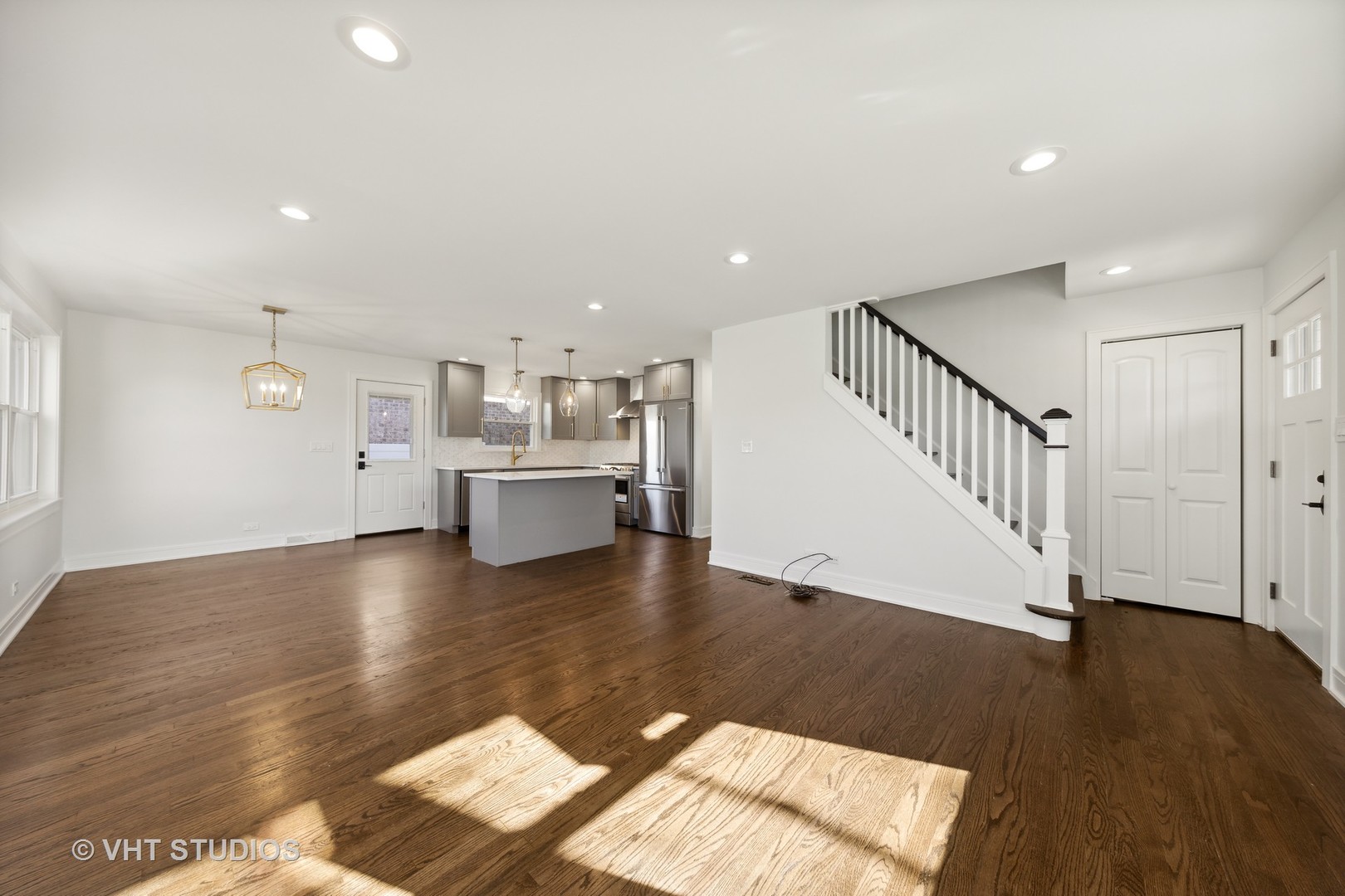 771 Swain Avenue Elmhurst, IL 60126 - Photo 5 of 43 a view of a living room with wooden floor and windows