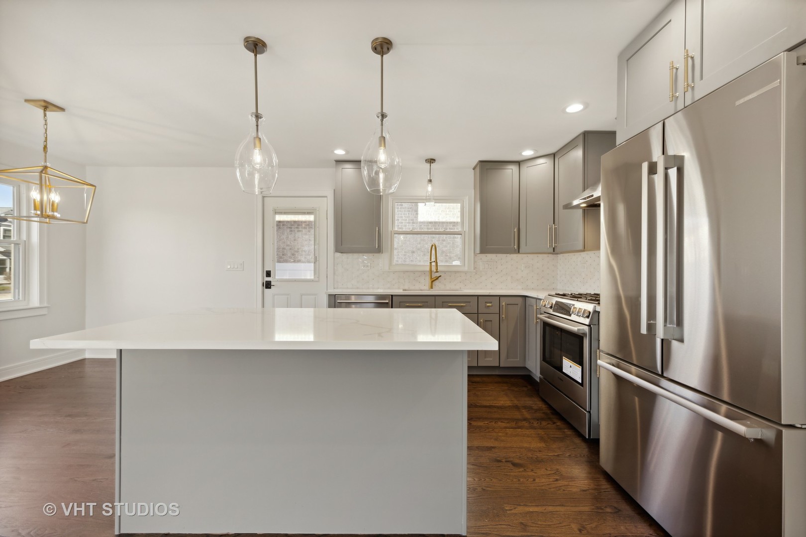 771 Swain Avenue Elmhurst, IL 60126 - Photo 9 of 43 a kitchen with stainless steel appliances a refrigerator sink and cabinets