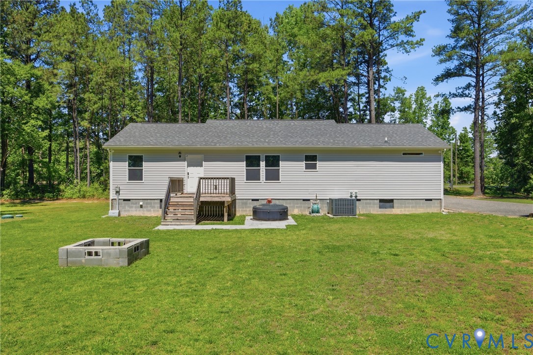 93 Faraway Road Saluda, VA 23149 - Photo 34 of 58 front view of a house with a big yard