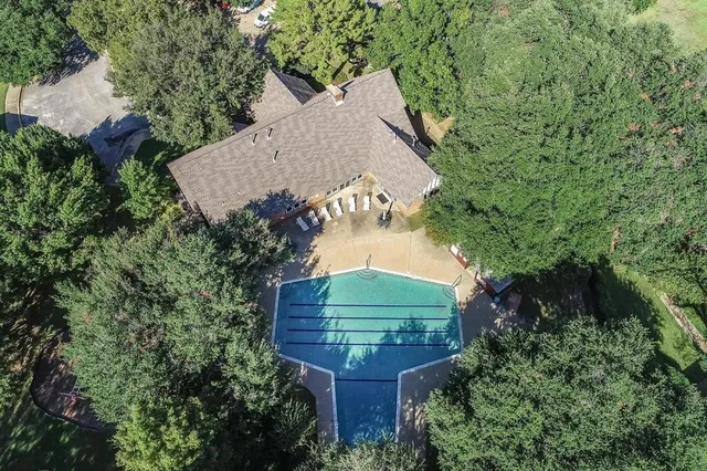 a wooden bench sitting in the middle of a park