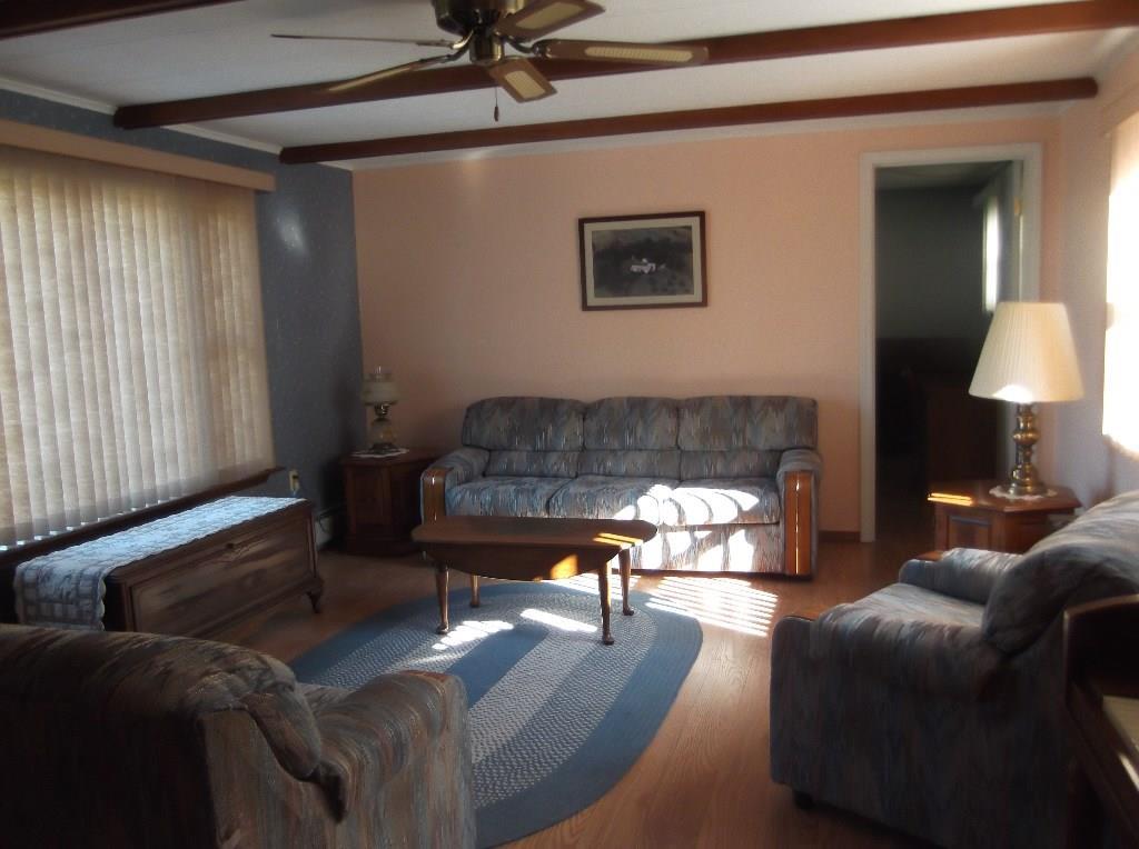 1235 Dexter Road Dover-Foxcroft, ME 04426 - Photo 11 of 26 Other view of living room with door...