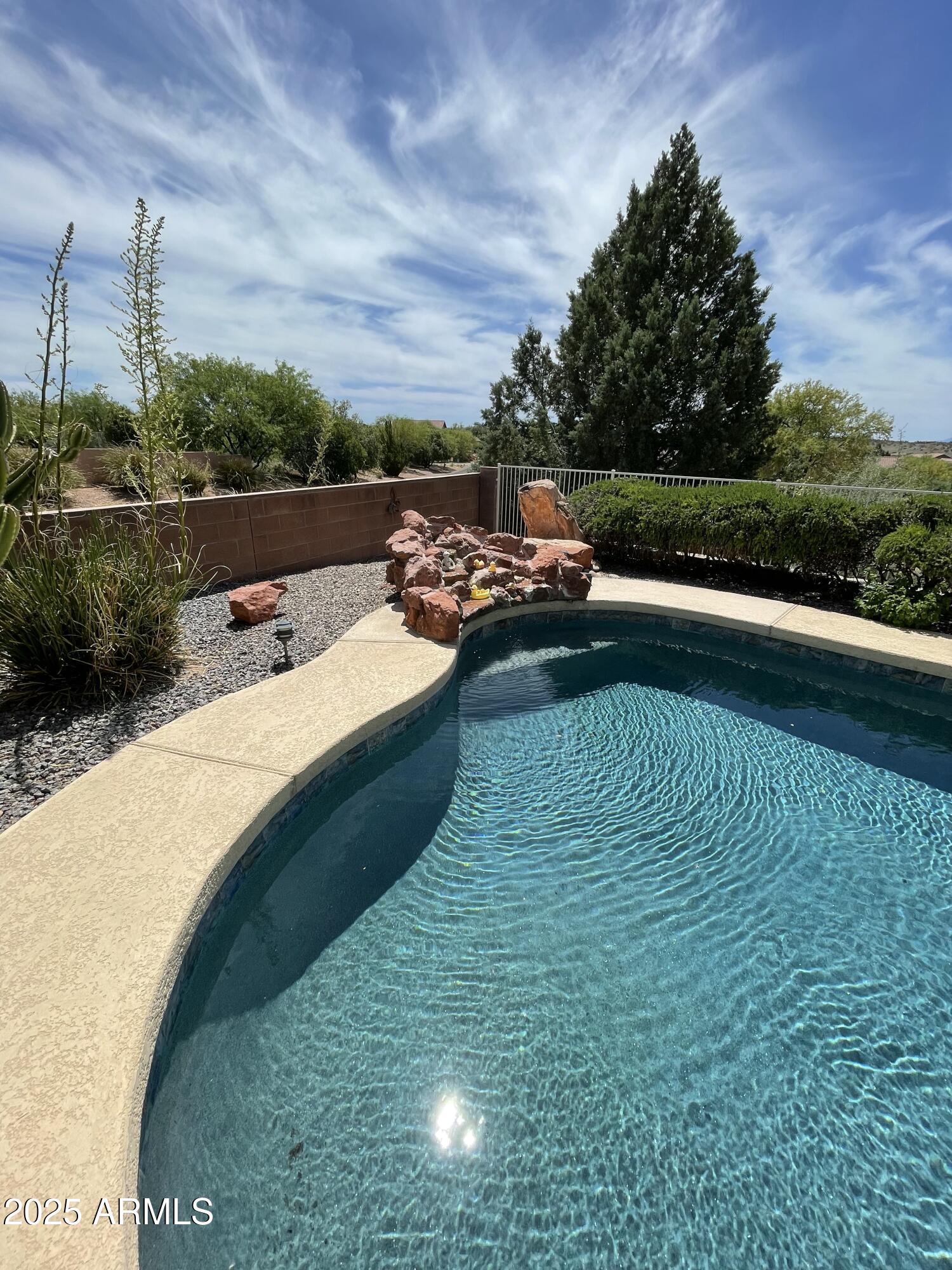 5325 Whisper Ridge Cornville, AZ 86325 - Photo 11 of 54 a view of a swimming pool with a yard