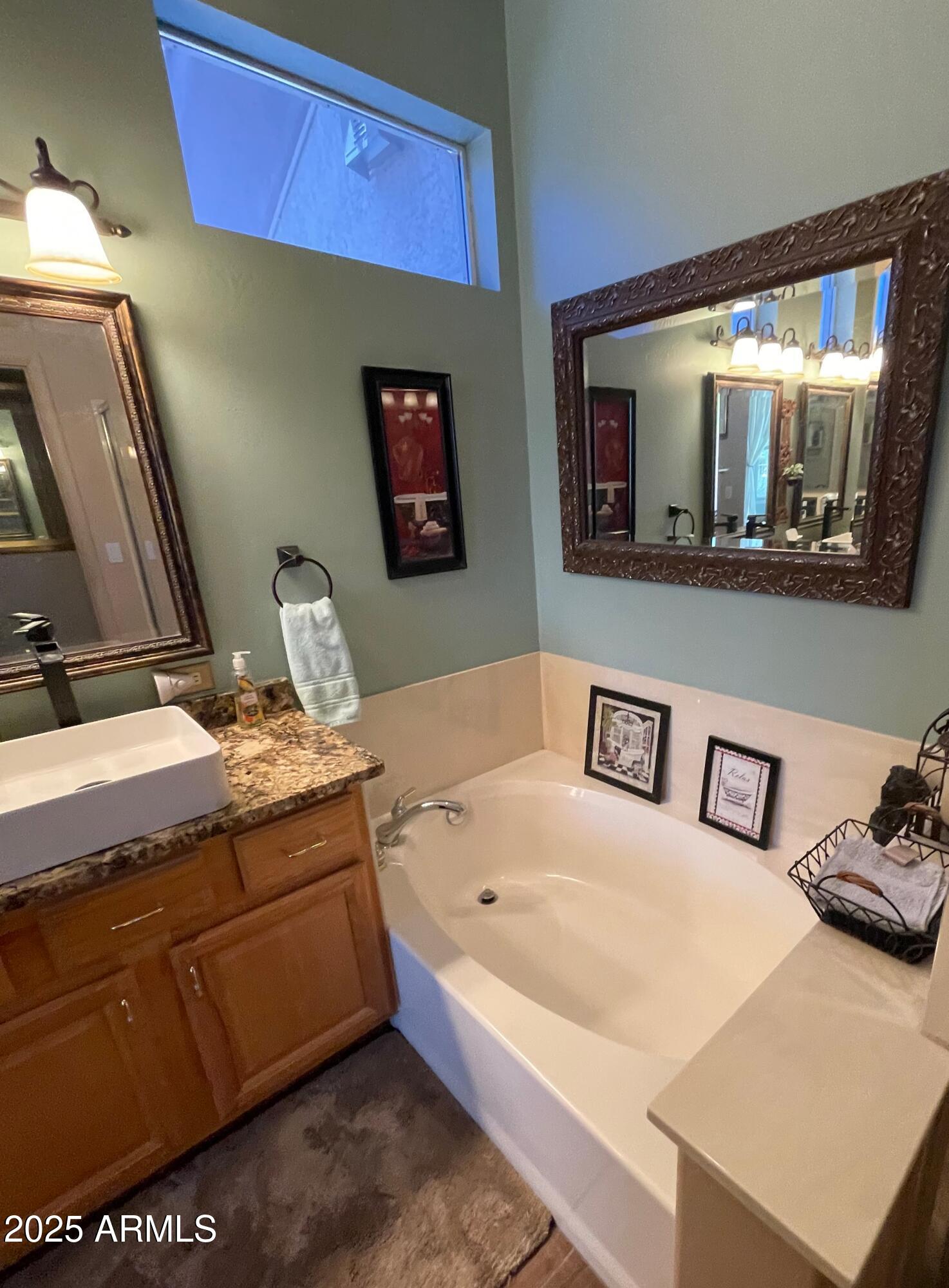 5325 Whisper Ridge Cornville, AZ 86325 - Photo 49 of 54 a bathroom with a sink a mirror and a toilet
