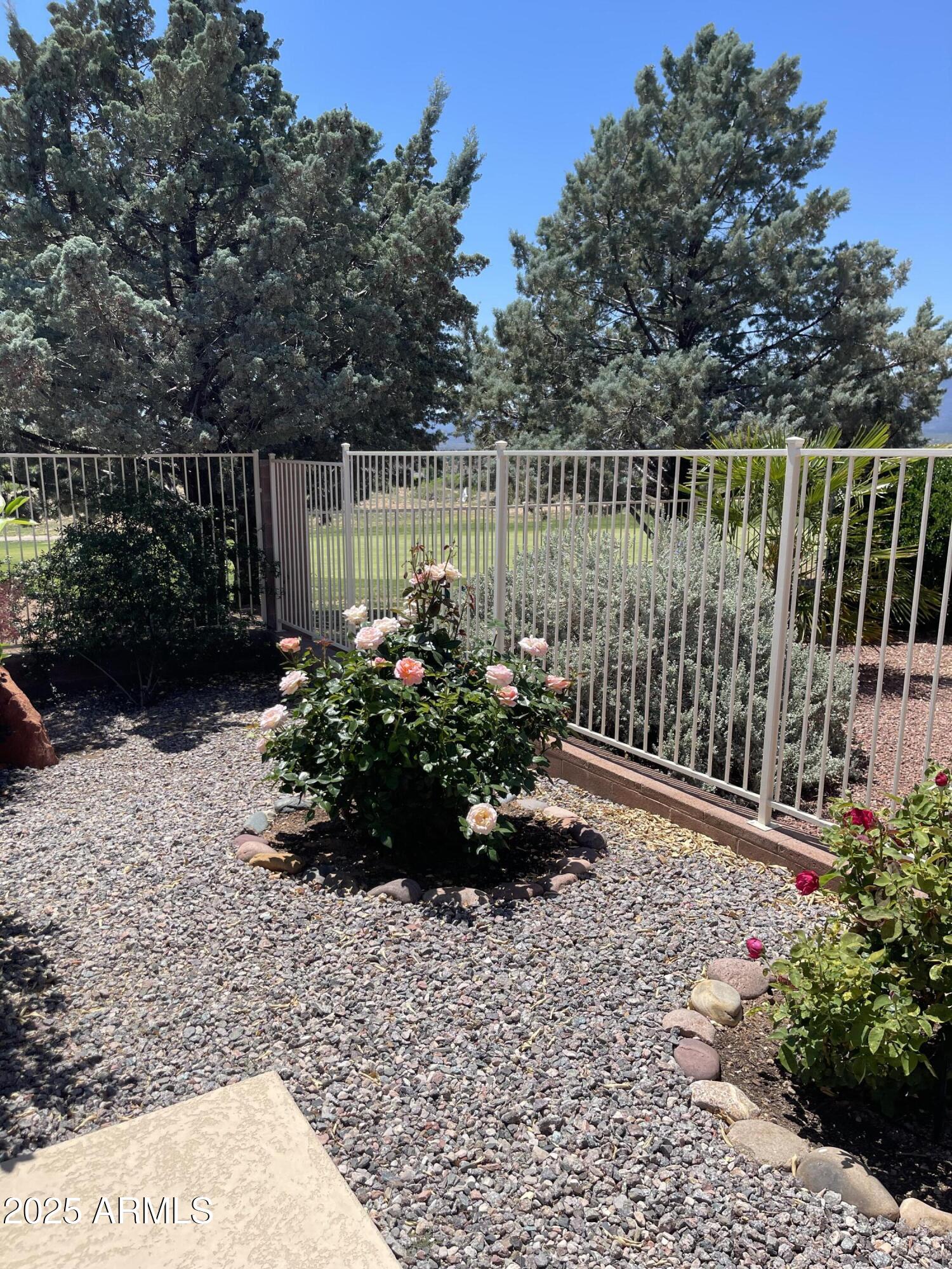 5325 Whisper Ridge Cornville, AZ 86325 - Photo 8 of 54 a view of a garden with wooden fence
