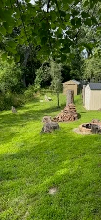 a backyard of a house with lots of green space