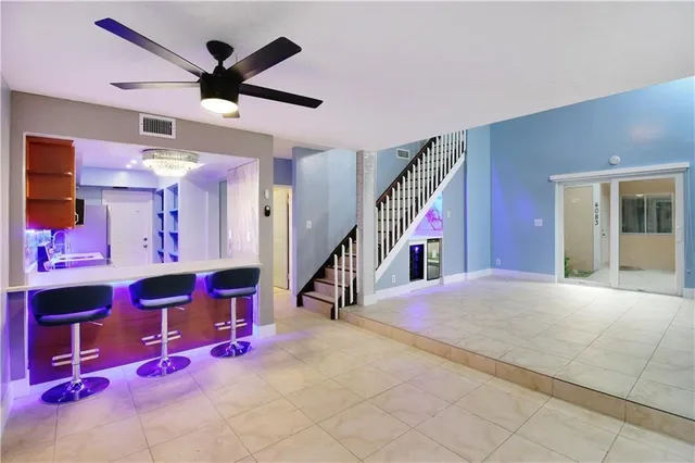 a very nice looking bedroom with a bed and a ceiling fan