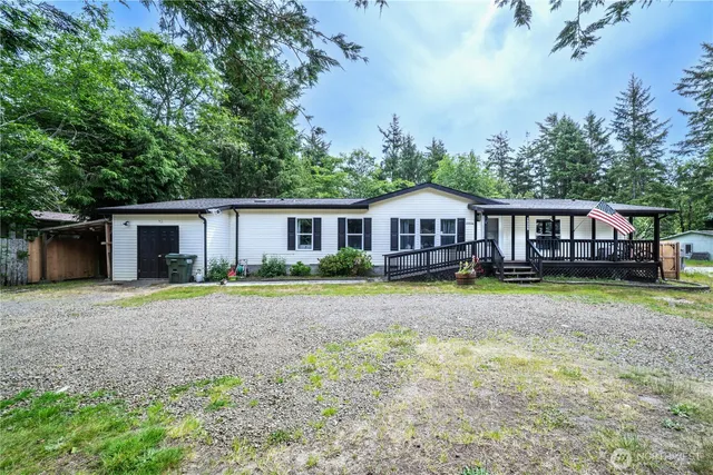 a view of house with outdoor space and swimming pool