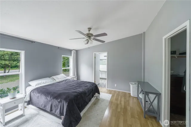 a bedroom with a bed and window