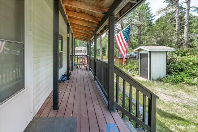 a view of deck with wooden floor and wooden fence