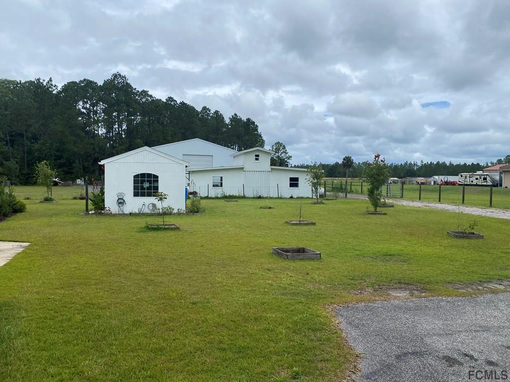 6050 County Road 304 Bunnell, FL 32110 - Photo 2 of 4 a view of a house with a big yard