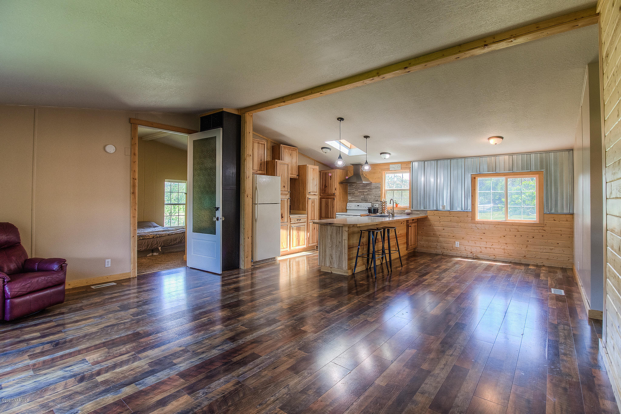 80 Fortune Road Naches, WA 98937 - Photo 4 of 20 a view of an empty room with wooden floor and a window