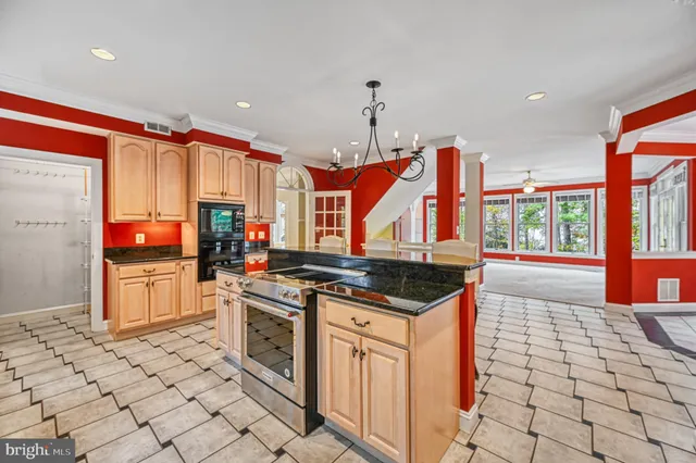 a view of a livingroom with a ceiling fan and window