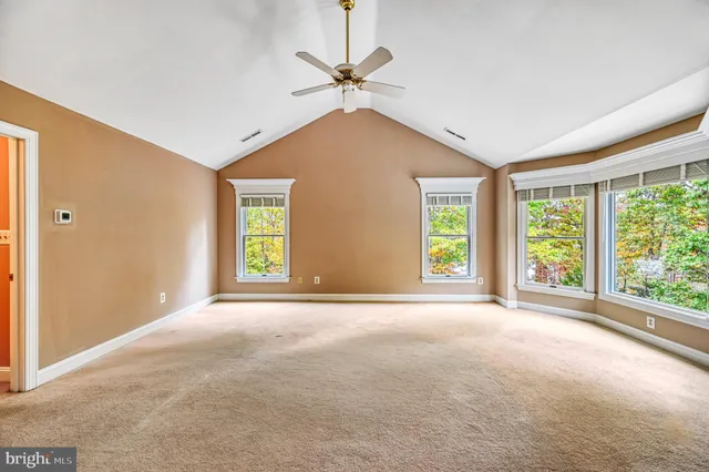 a view of a chairs and tables in the balcony