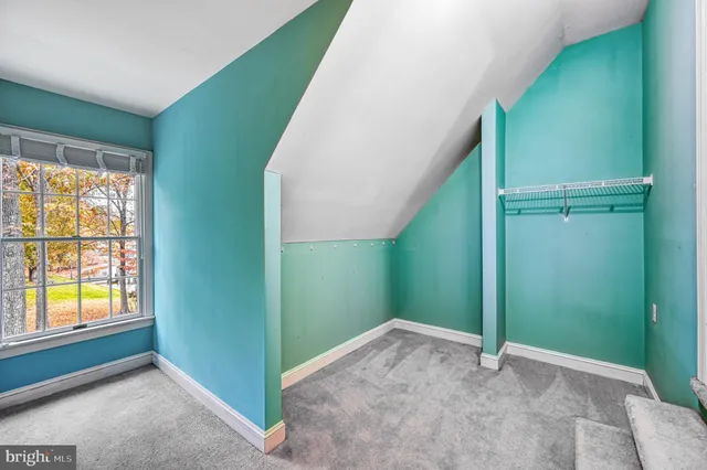 an aerial view of a house with outdoor space and lake view