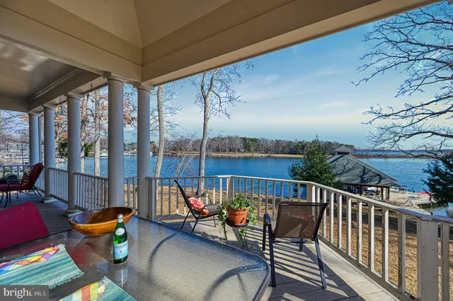 a spacious bedroom with a bed and a chandelier