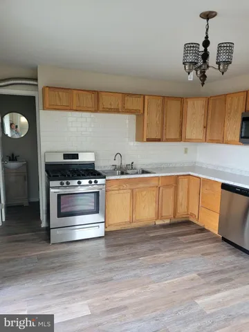 a kitchen with a refrigerator and a sink